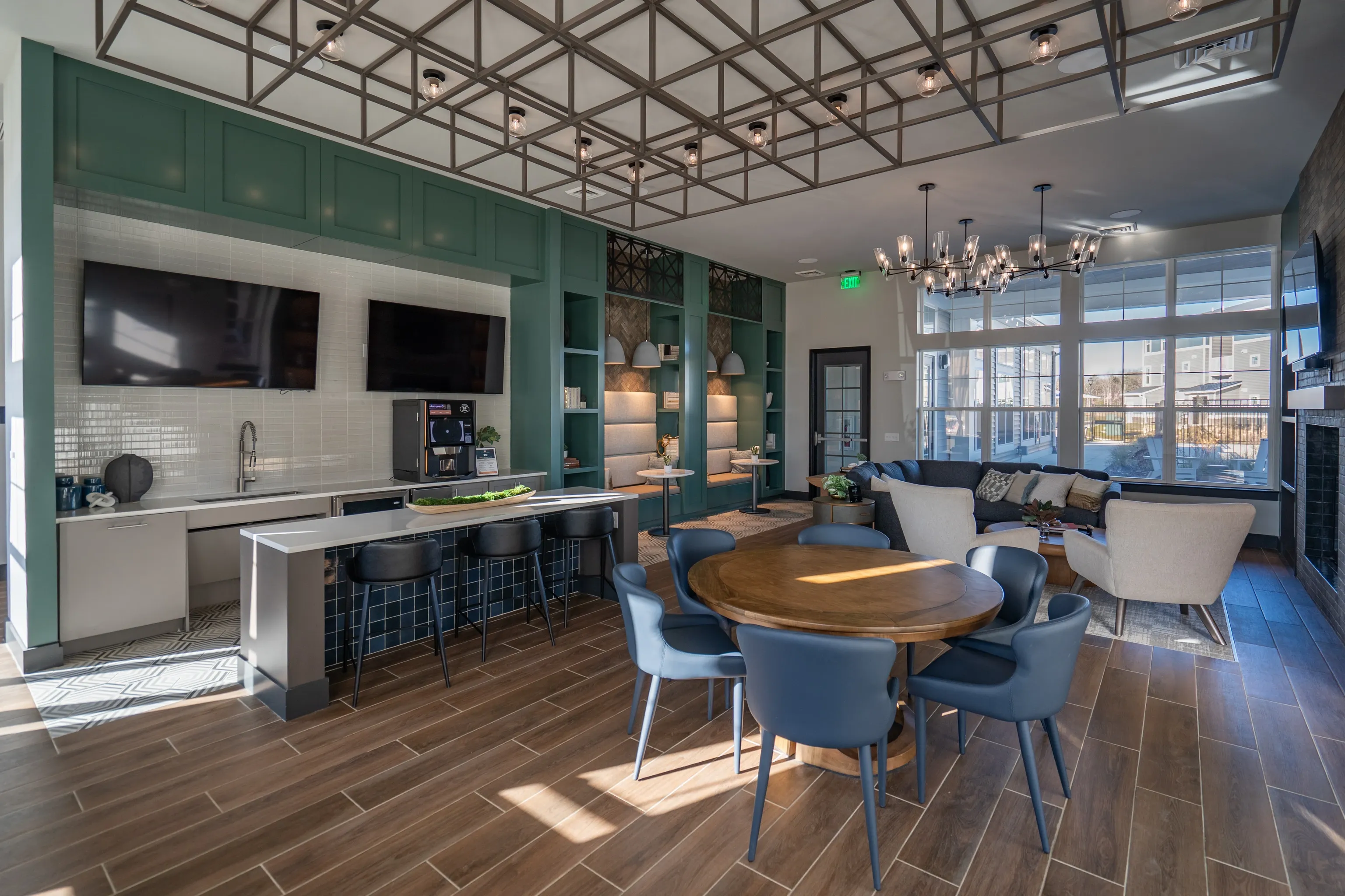 Community lounge area with a wet bar, seating, and dining table.