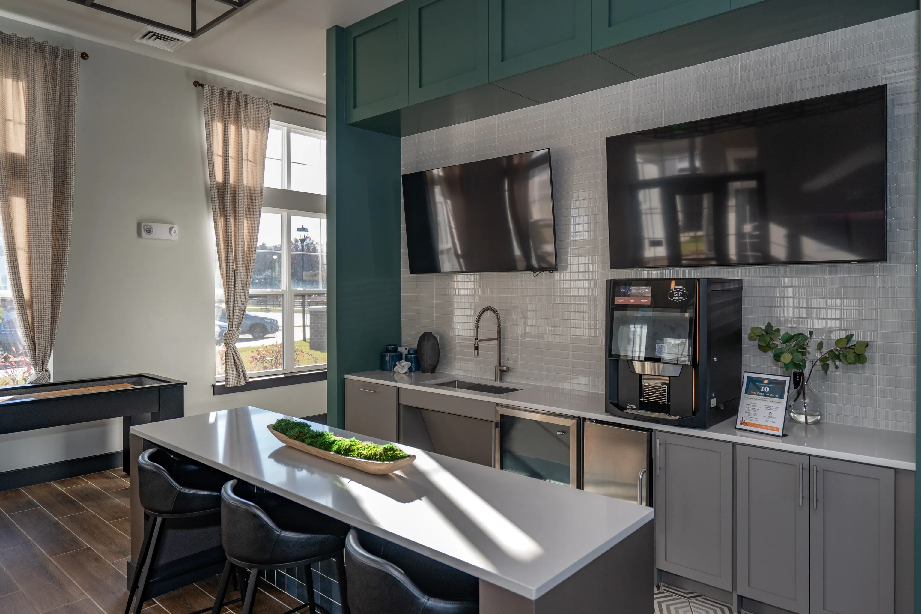 Community kitchen with coffee maker and entertainment area.