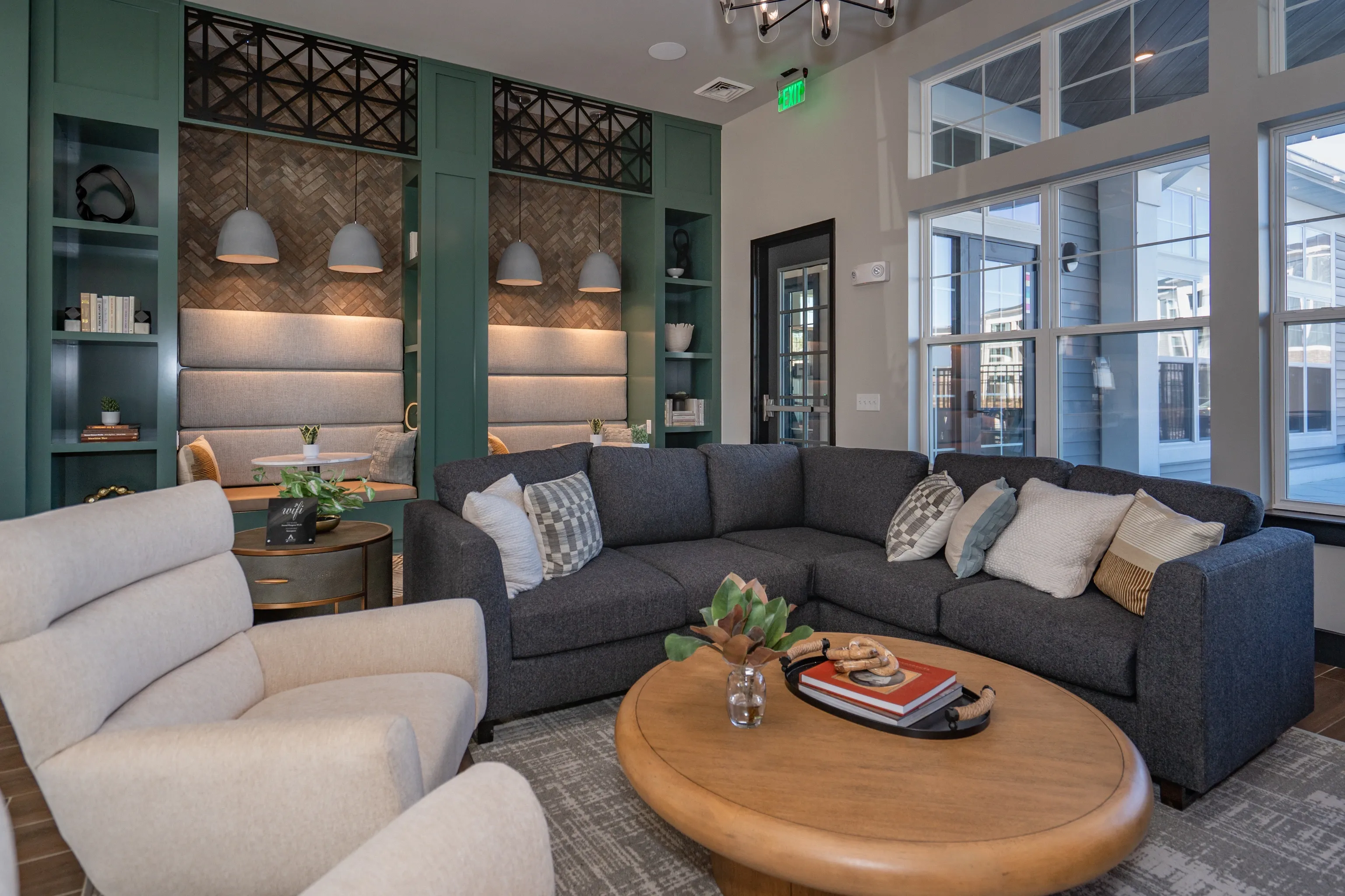 Modern lounge area with sectional sofa, armchair, and coffee table.