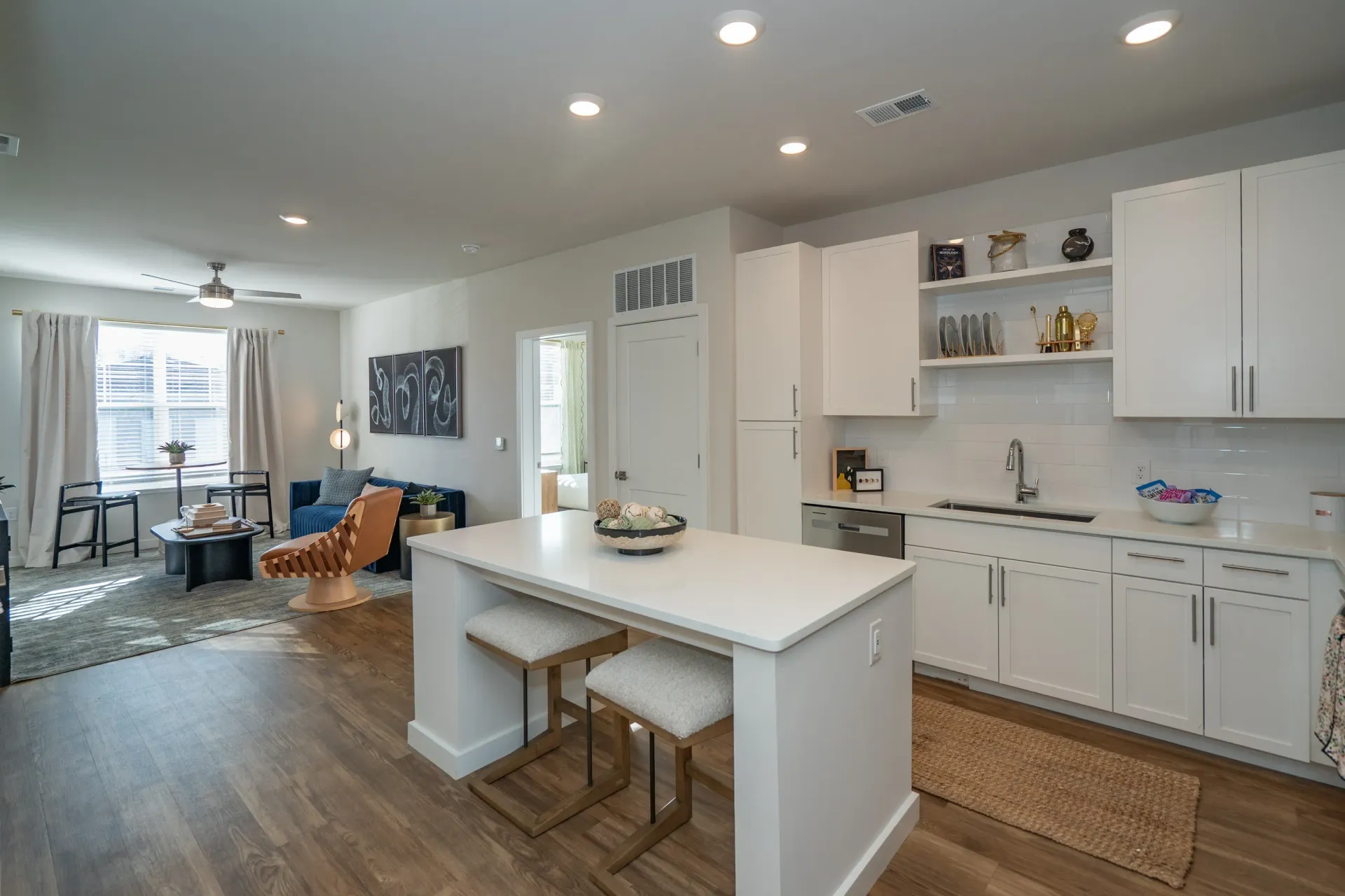 Modern kitchen with island and living room area