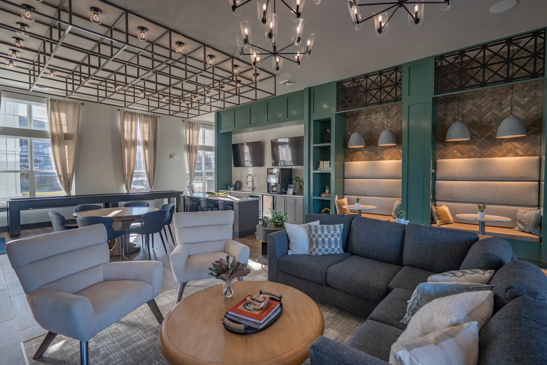 Modern lounge area with comfortable seating, a coffee bar, and a billiards table.