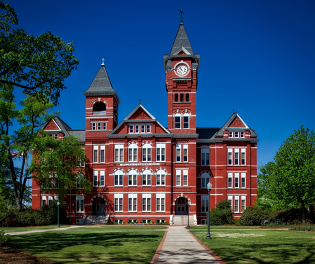 A large red brick building with a clock tower