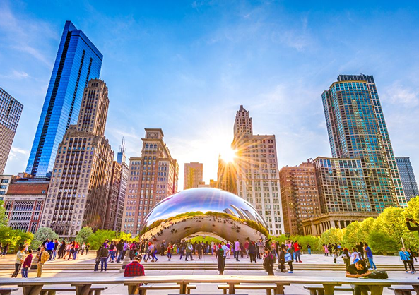 The sun is shining through the cloud gate in chicago.