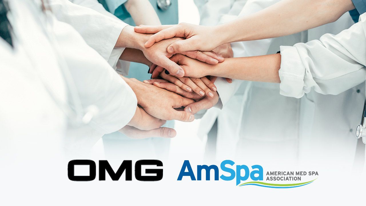 Medical team stacking hands together with OMG and AmSpa logos