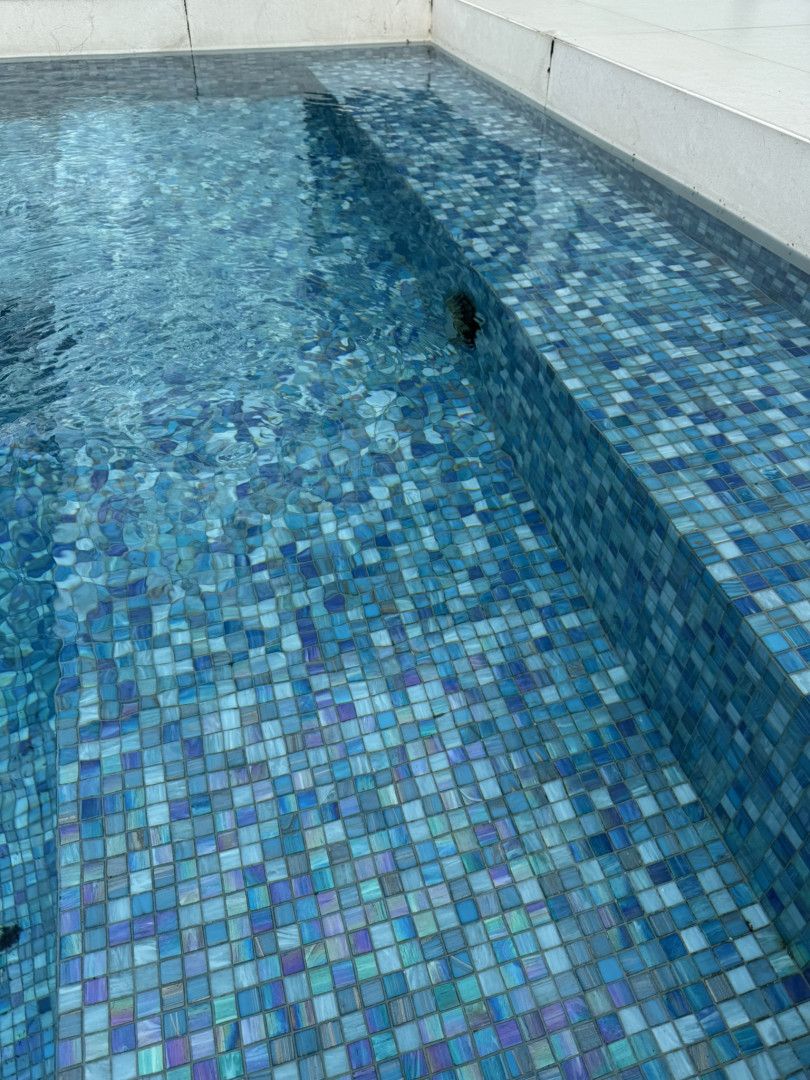 A Close up Of a Swimming Pool with Blue Tiles on The Floor — Poolside Noosa in Noosaville, QLD