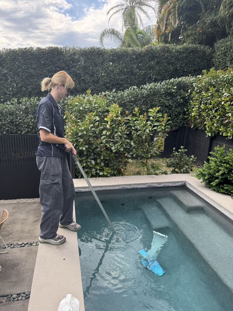 A person Is Cleaning a Swimming Pool — Poolside Noosa in Noosaville, QLD