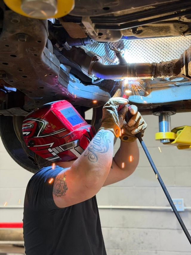 Auto Technician Performing Undercarriage Repair | ProDrive Auto Care