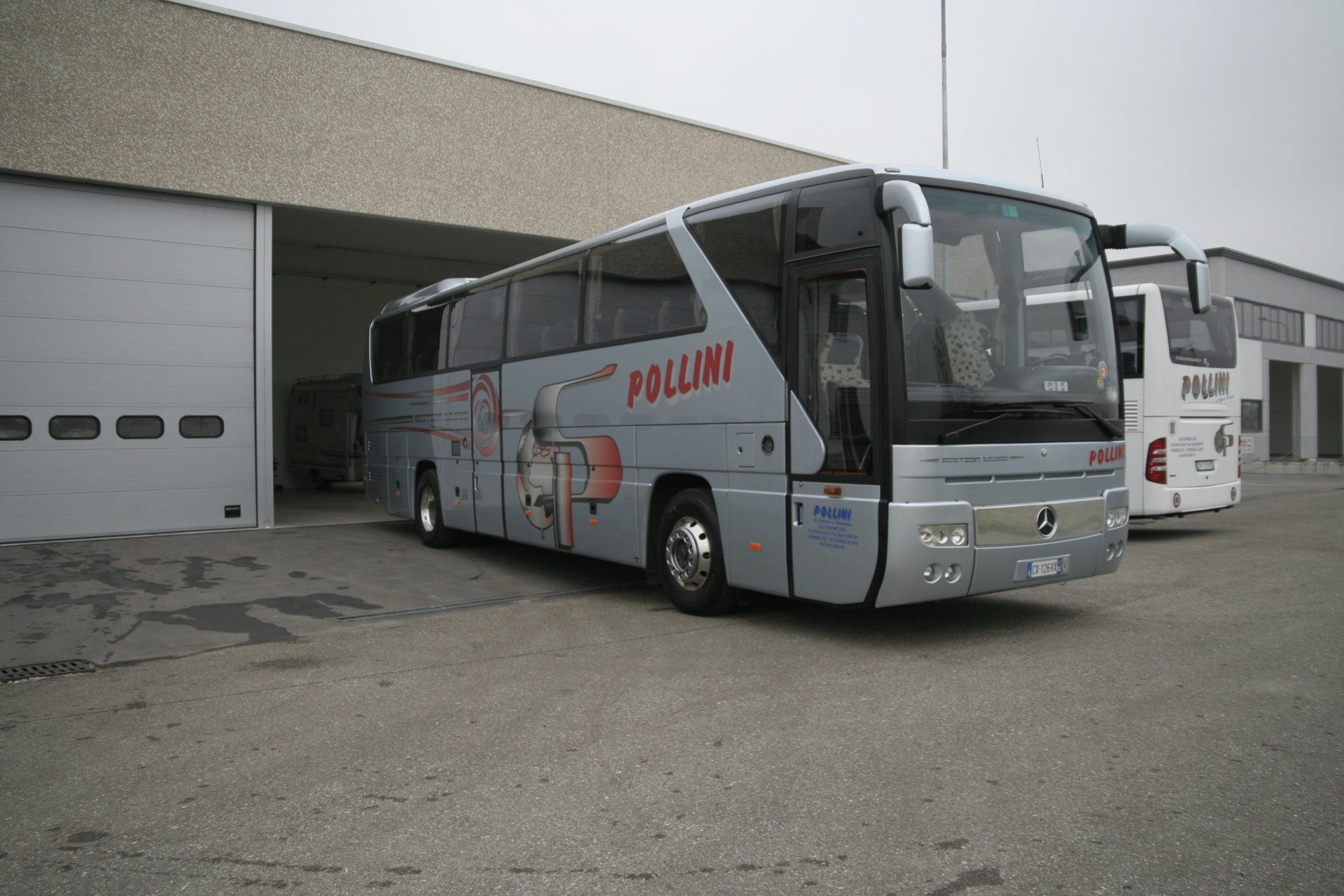 Grey and silver bus with the