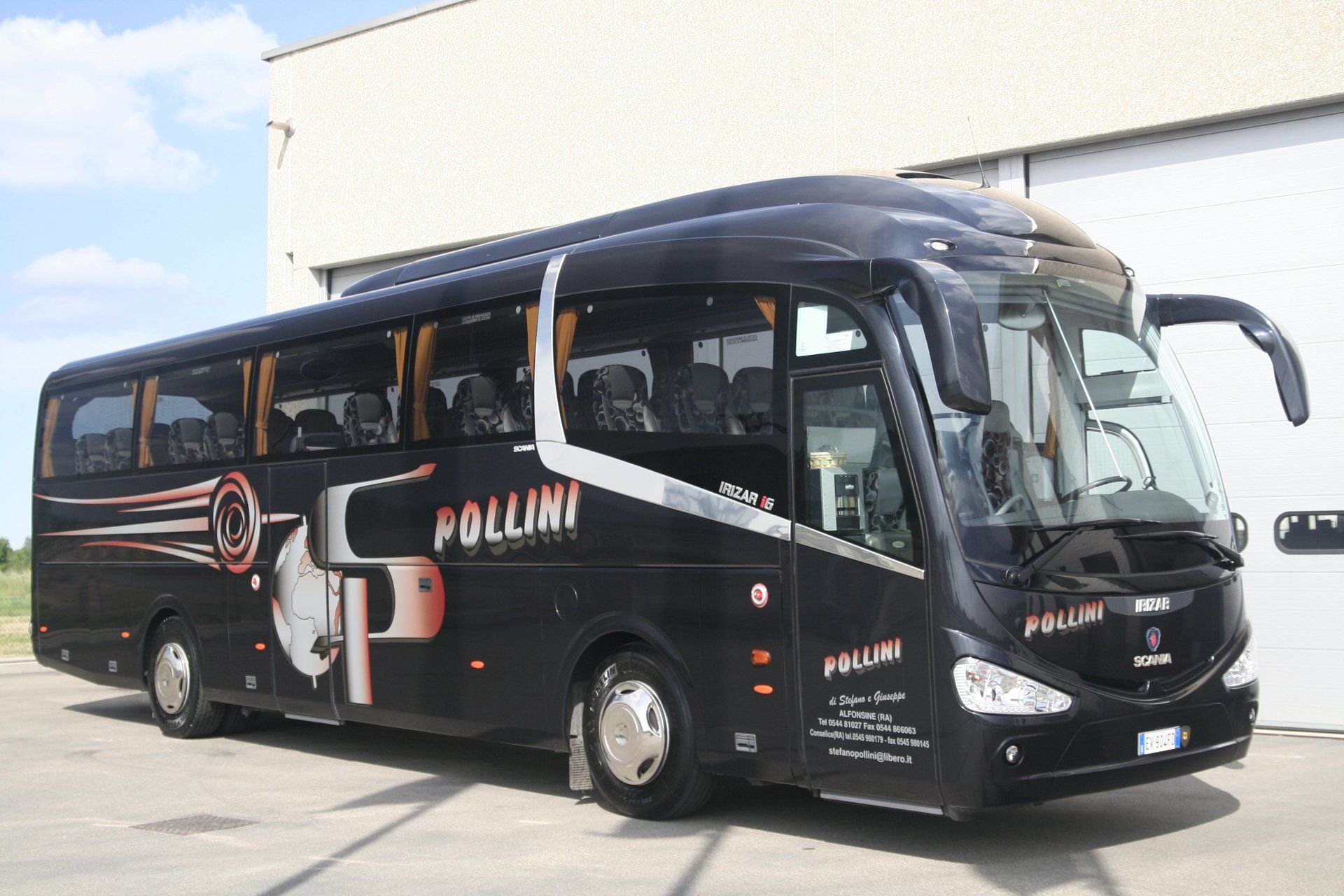 Black Pollini tourist bus parked outside with logo and lettering.
