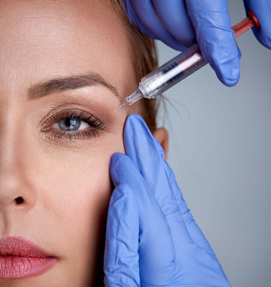 A woman is getting an injection in her eye