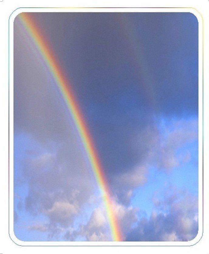 Rainbow in the sky with clouds