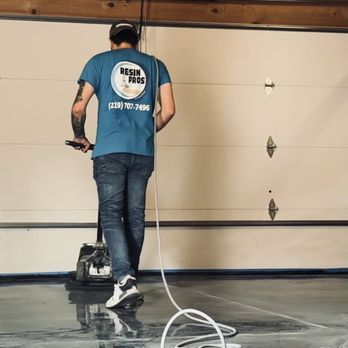 A solid color epoxy flooring in Valparaiso, IN - Resin Pros hard at work