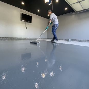 A solid color epoxy flooring in Valparaiso, IN - Resin Pros hard at work
