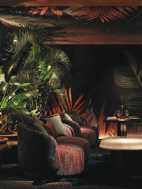 A living room with a couch and chairs and a table