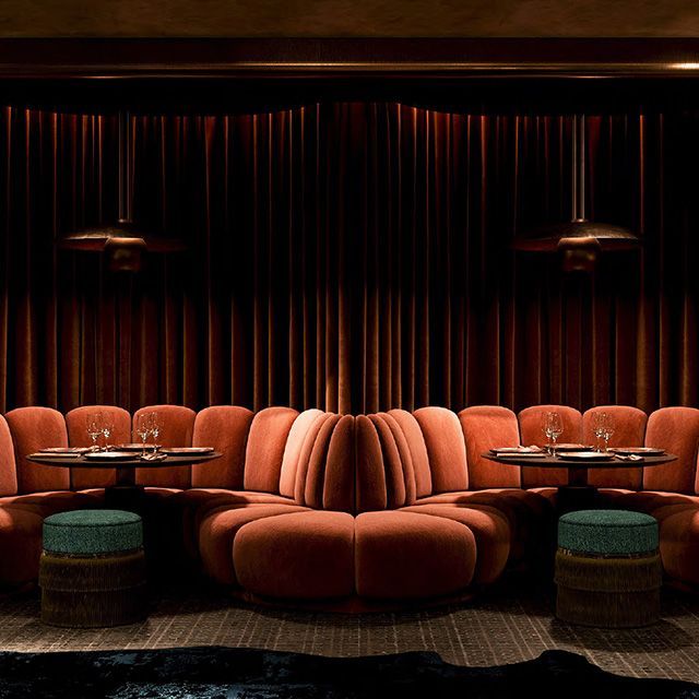 Cushioned sofa sofa seating around two cocktail tables at the Harbour Club members only club in Miami Beach.