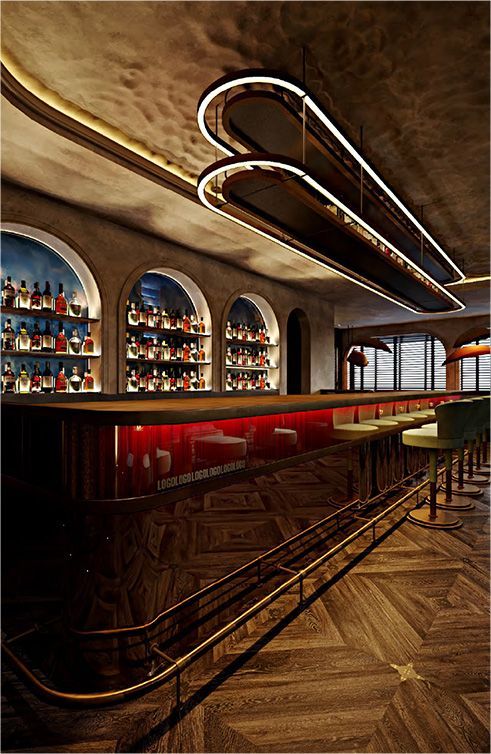 A bar event space in Miami Beach showing rows of bottles on the shelves and a wooden floor at Harbour Club.