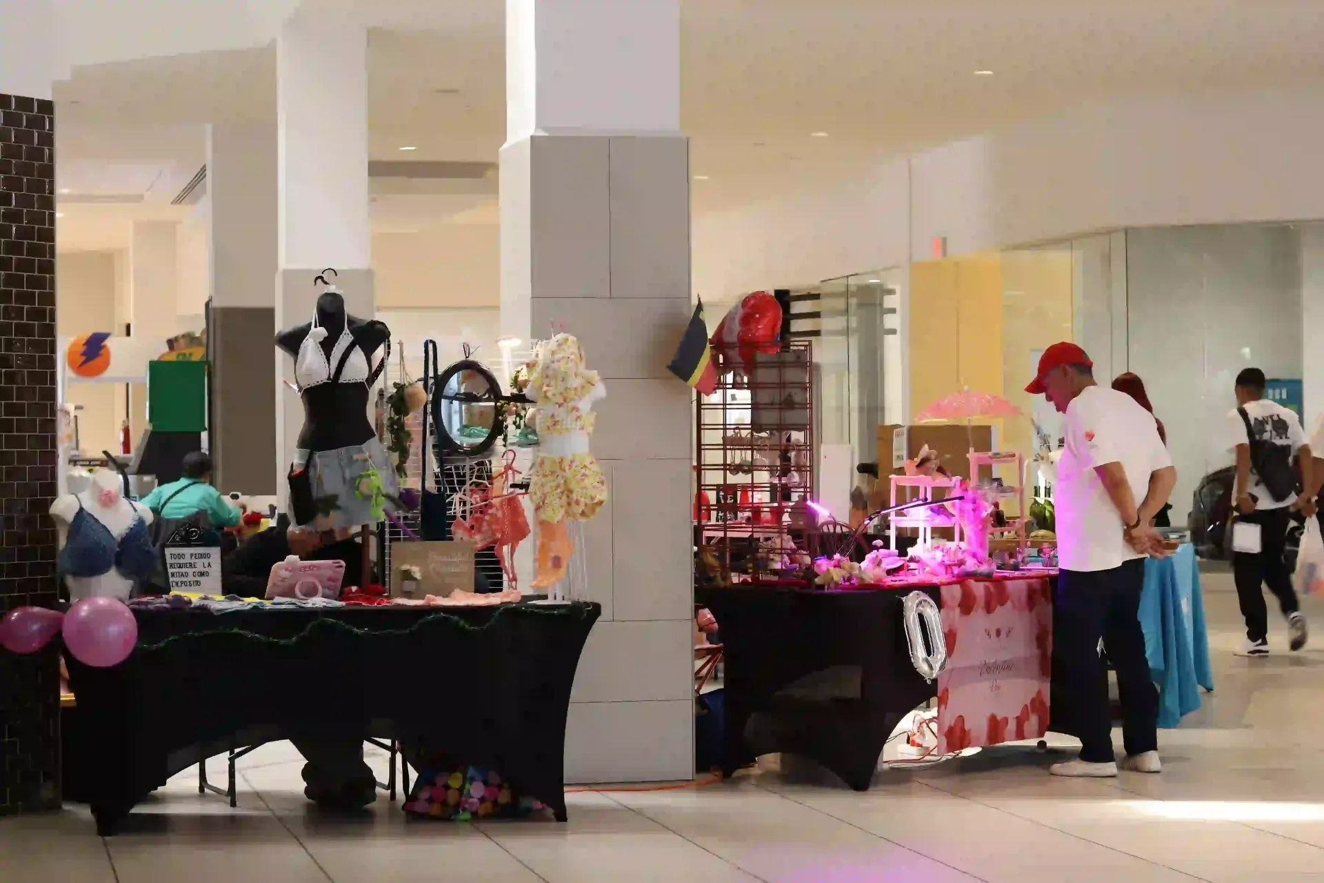 Shops set up in a brightly lit indoor mall, Céntrico Guayama.