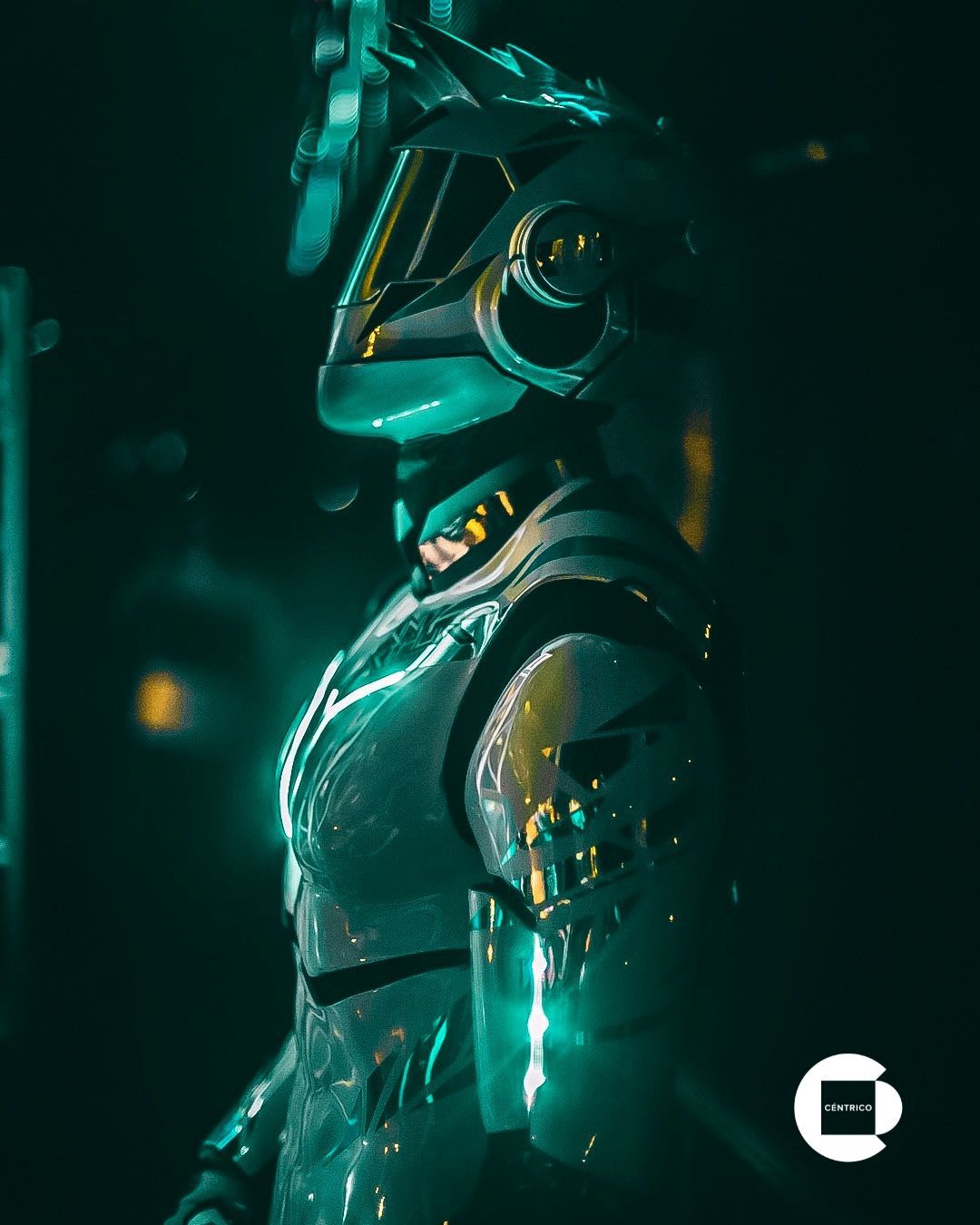 Futuristic armored figure in teal-lit profile, glowing with metallic accents against a dark background