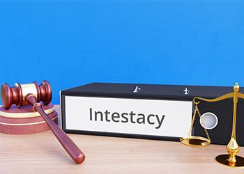 Gavel, scales of justice, and a binder labeled