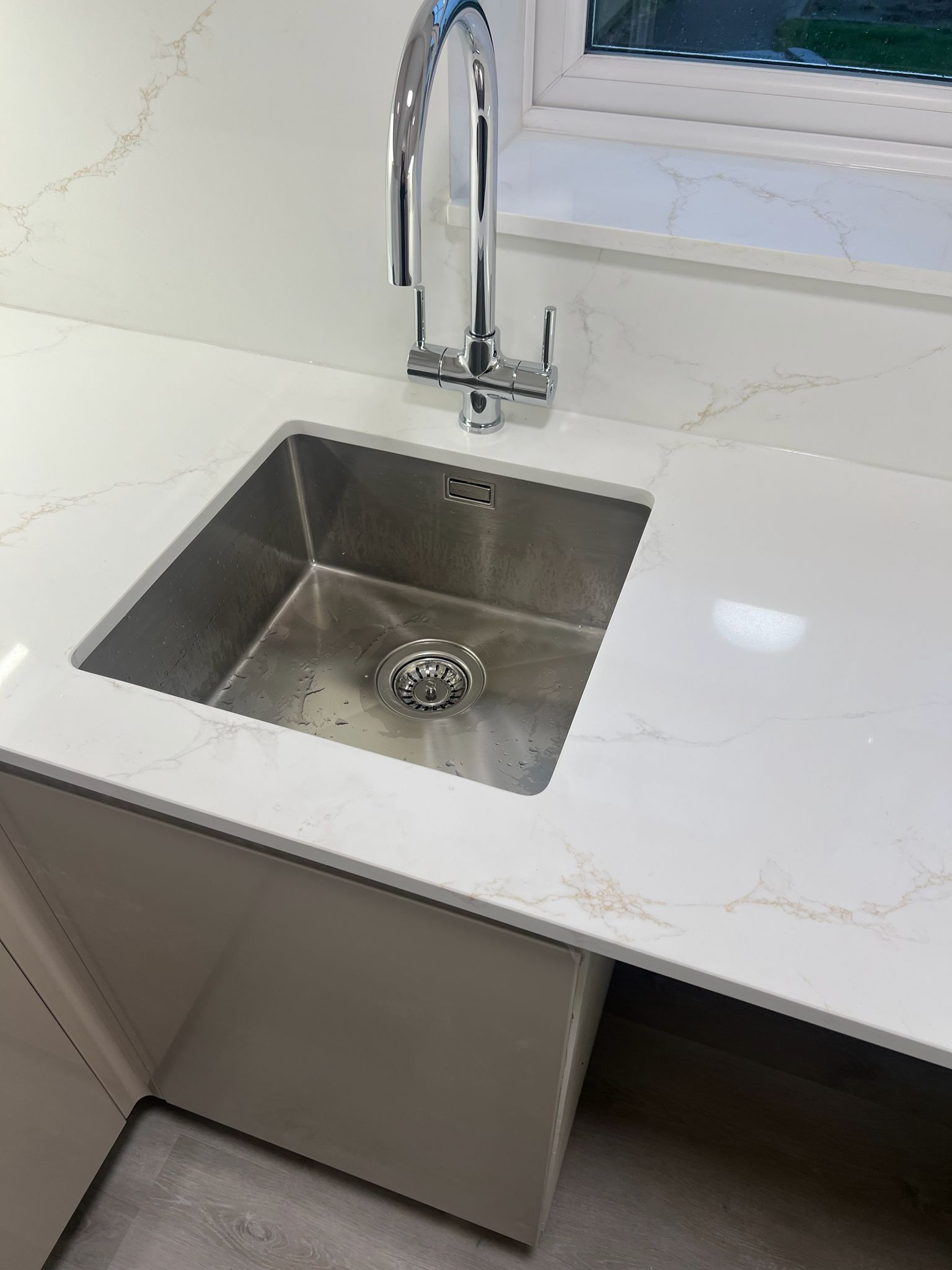 Chrome mixer kitchen tap and undermount sink fitted in new kitchen by local fitter in Reading