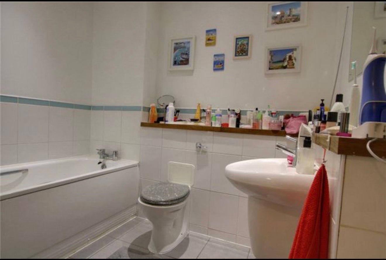 Before pic of a bathroom remodel replacing the bath with a shower carried out in Reading