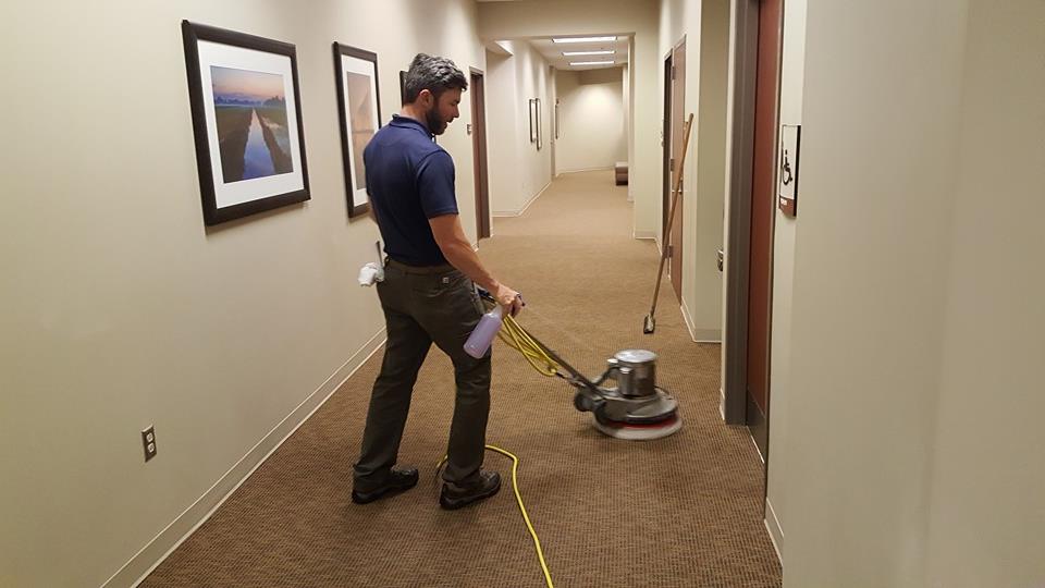 Worker cleaning carpet hallway — Murfreesboro, TN — Drycon of Middle Tennessee