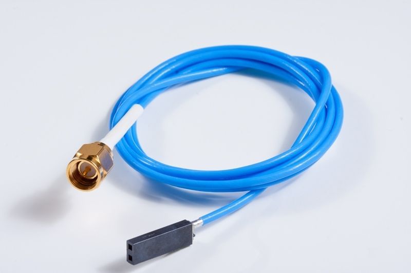 Blue cable with gold connector and black connector against a white background.