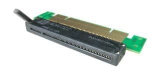 An adapter for a computer card, green and gold with a black connector.