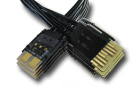 Black PCI-e power cables with gold connectors, crossing over each other.