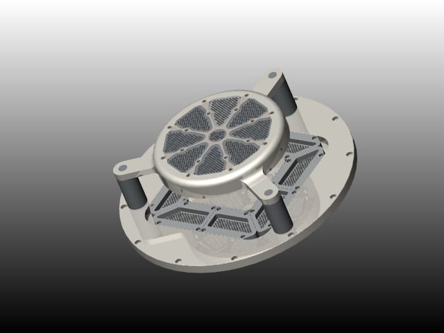 Metallic mechanical device with a circular base and intricate central structure.