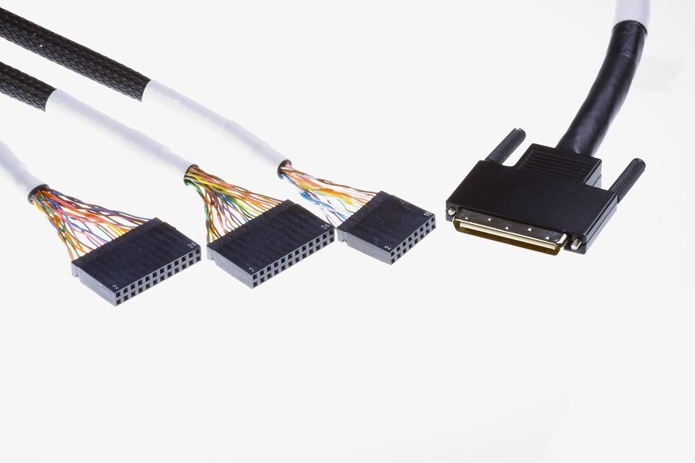 Three black and white wire bundles with multiple connector pins, terminating into a black D-sub connector.