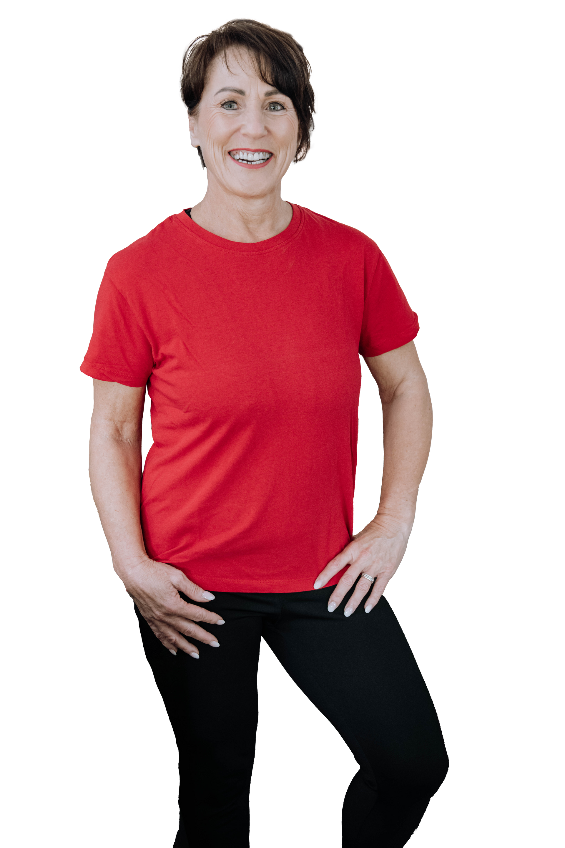 Person in a red shirt and black pants, standing with one hand on hip against a white background