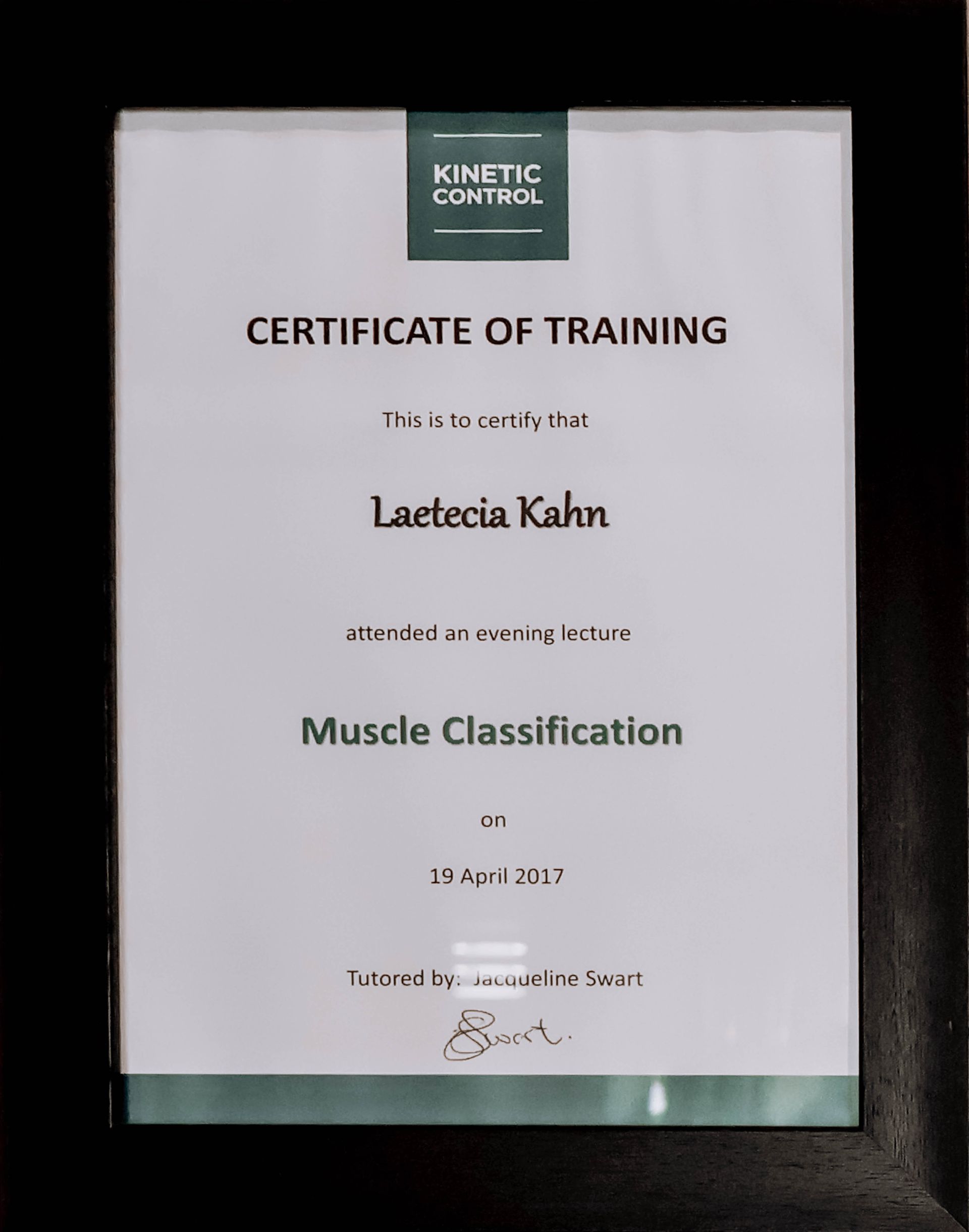 Framed certificate of training for Muscle Classification with a green Kinetic Control logo