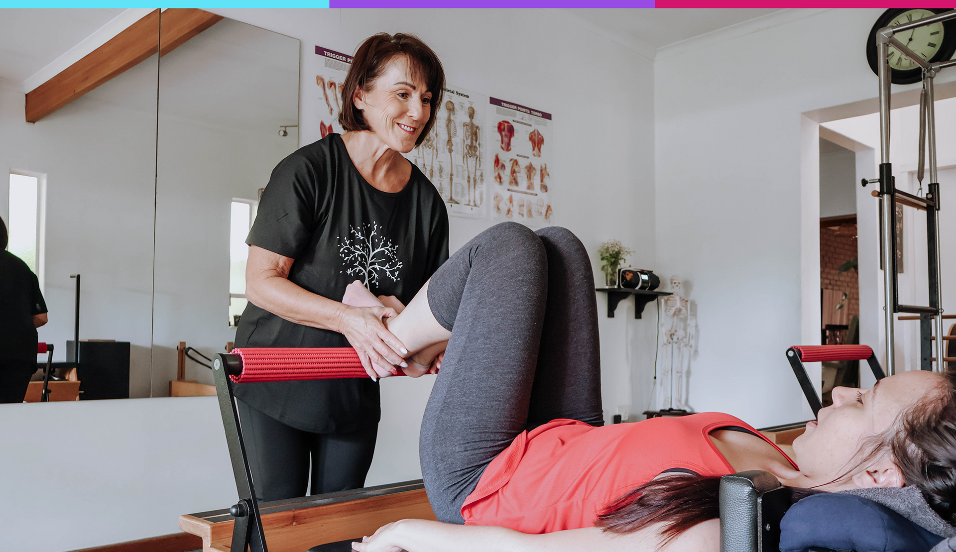 Person receiving a leg stretch from a therapist in a clinic room