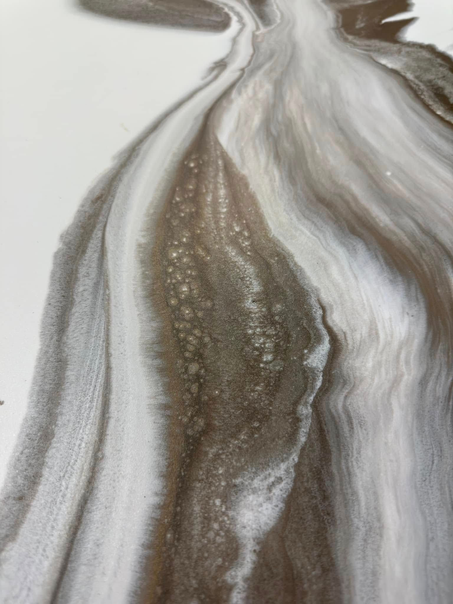 Swirling abstract art. Brown, white, and gray tones create flowing, textured patterns.