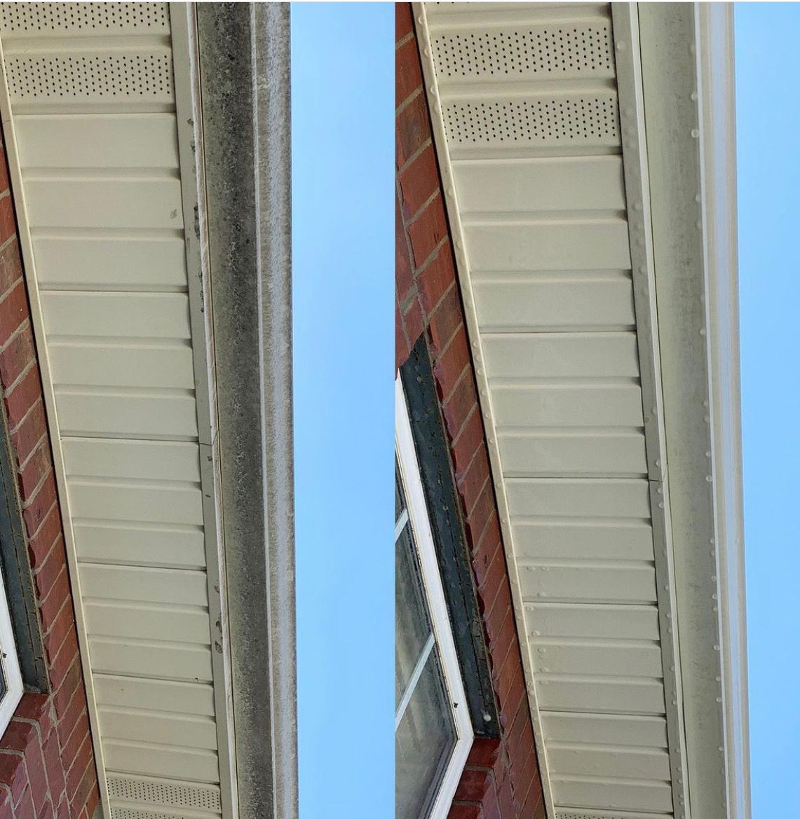 Side-by-side comparison of dirty and clean siding and gutter on a brick building, against a blue sky.