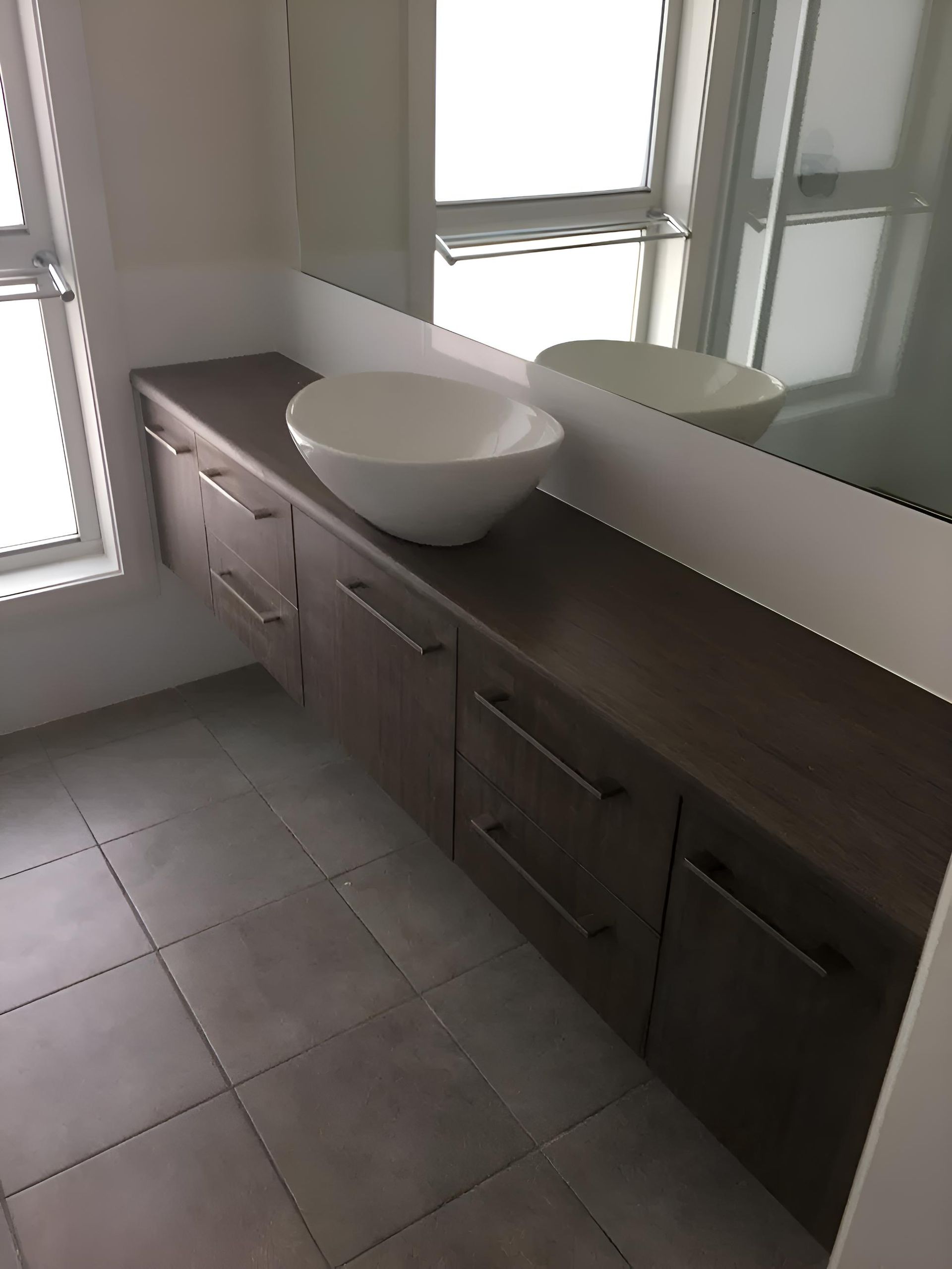 A Bathroom With Two Sinks and a Large Mirror — Hey Presto Kitchens & Renovations in Armidale, NSW