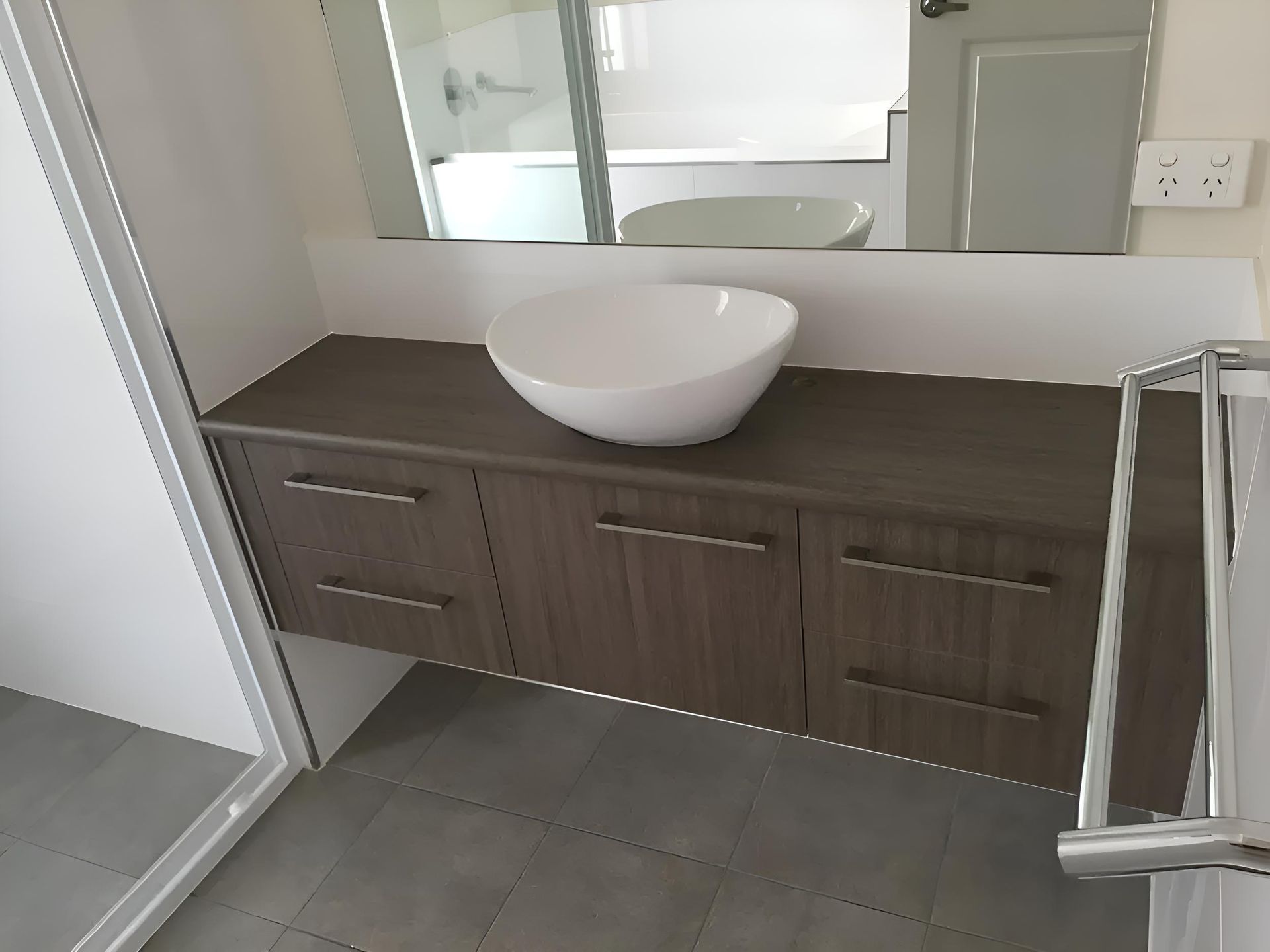 A Bathroom With A Sink And A Mirror — Hey Presto Kitchens & Renovations in Armidale, NSW