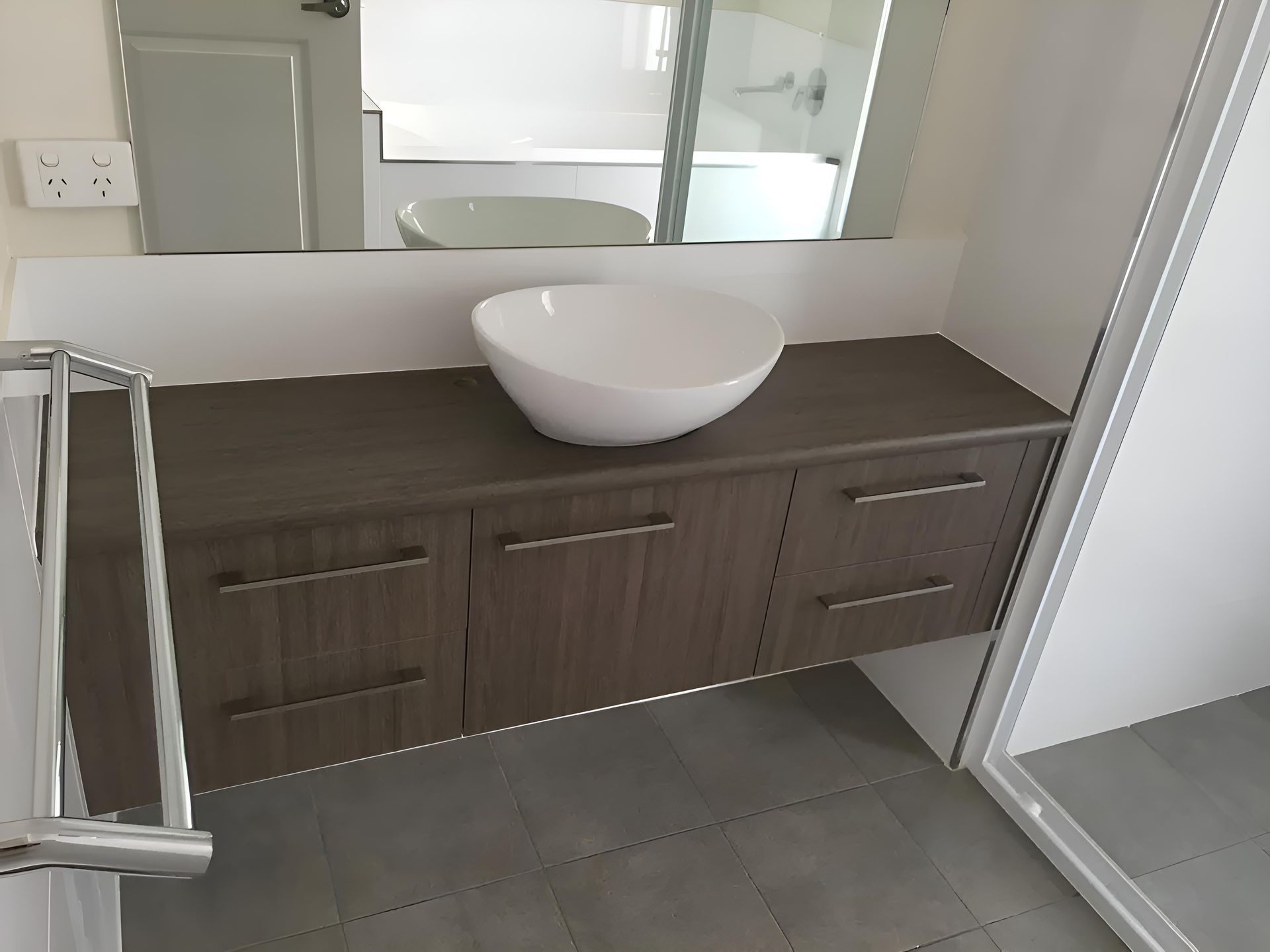 A Bathroom With a Sink and a Mirror — Hey Presto Kitchens & Renovations in Armidale, NSW