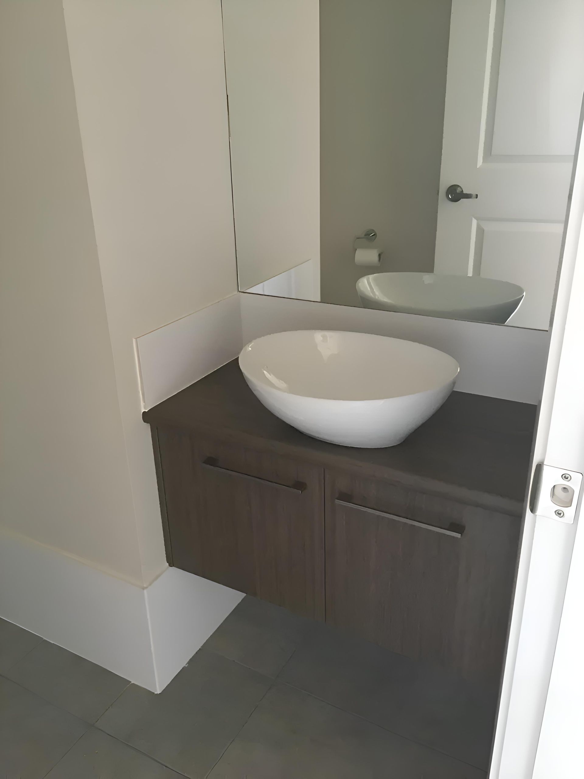 A Bathroom With A Sink And A Mirror — Hey Presto Kitchens & Renovations in Armidale, NSW