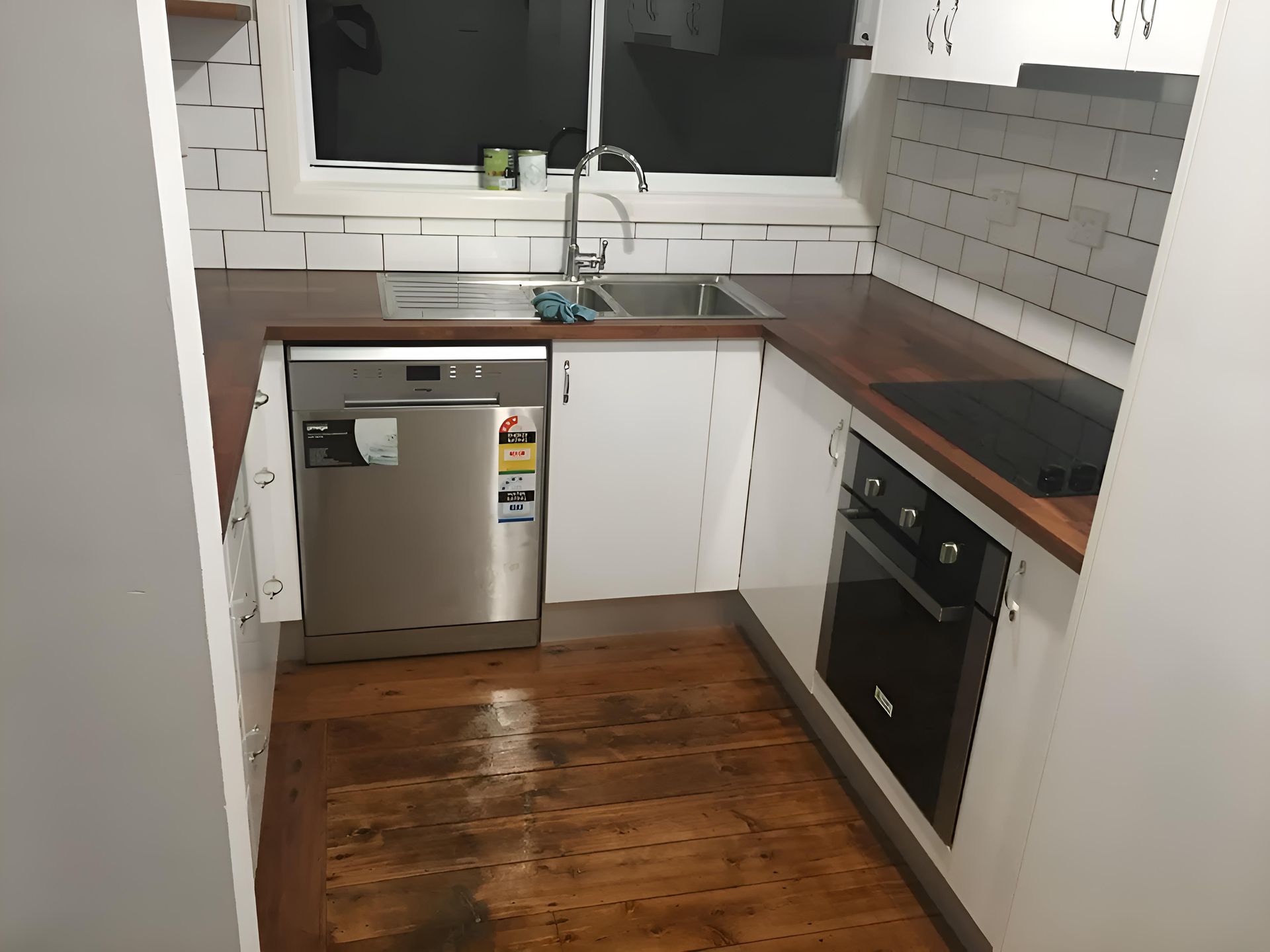 A Kitchen With Stainless Steel Appliances And Wooden Counter Tops — Hey Presto Kitchens & Renovations in Armidale, NSW