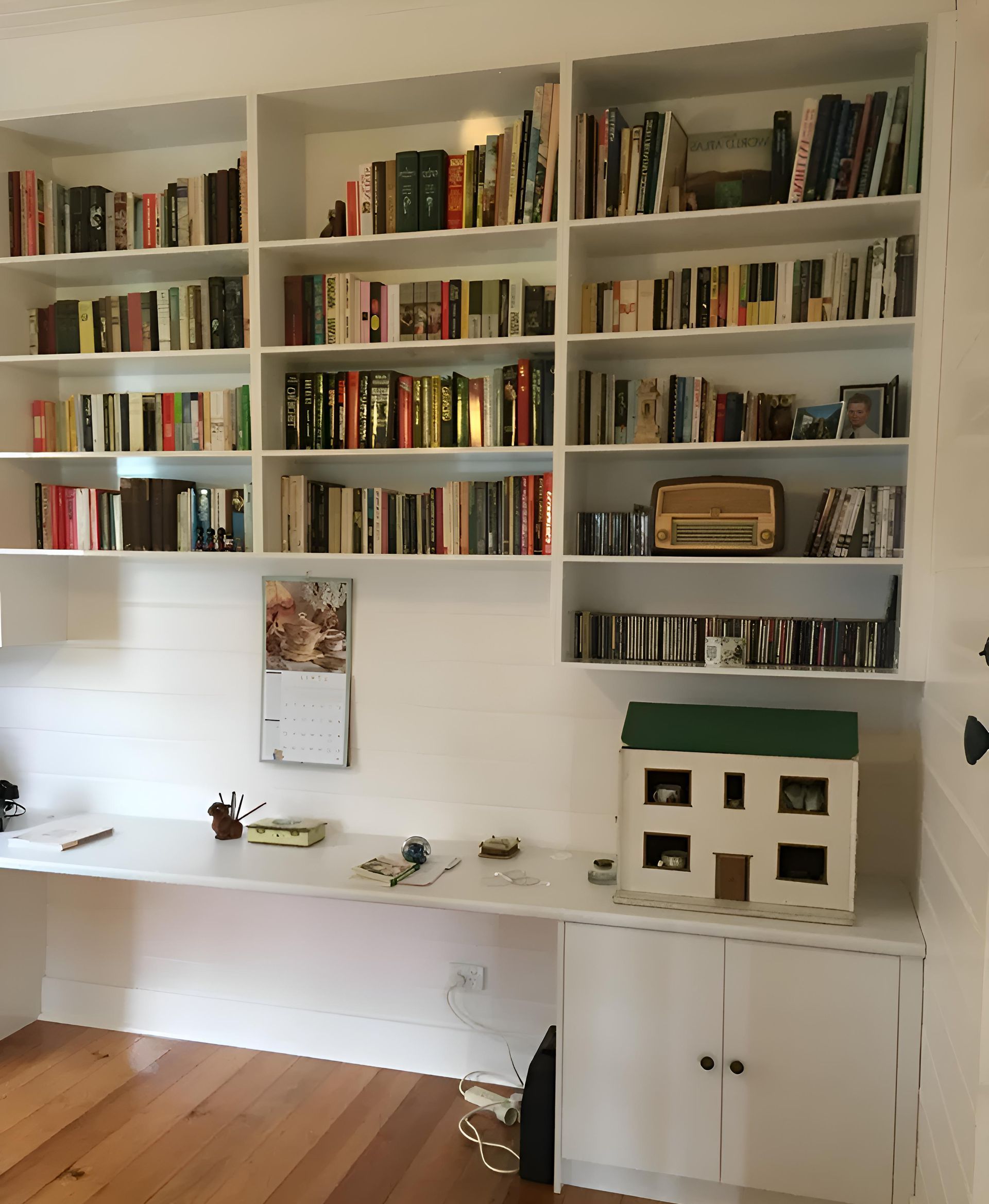 A Bookshelf With Lots Of Books On It — Hey Presto Kitchens & Renovations in Armidale, NSW