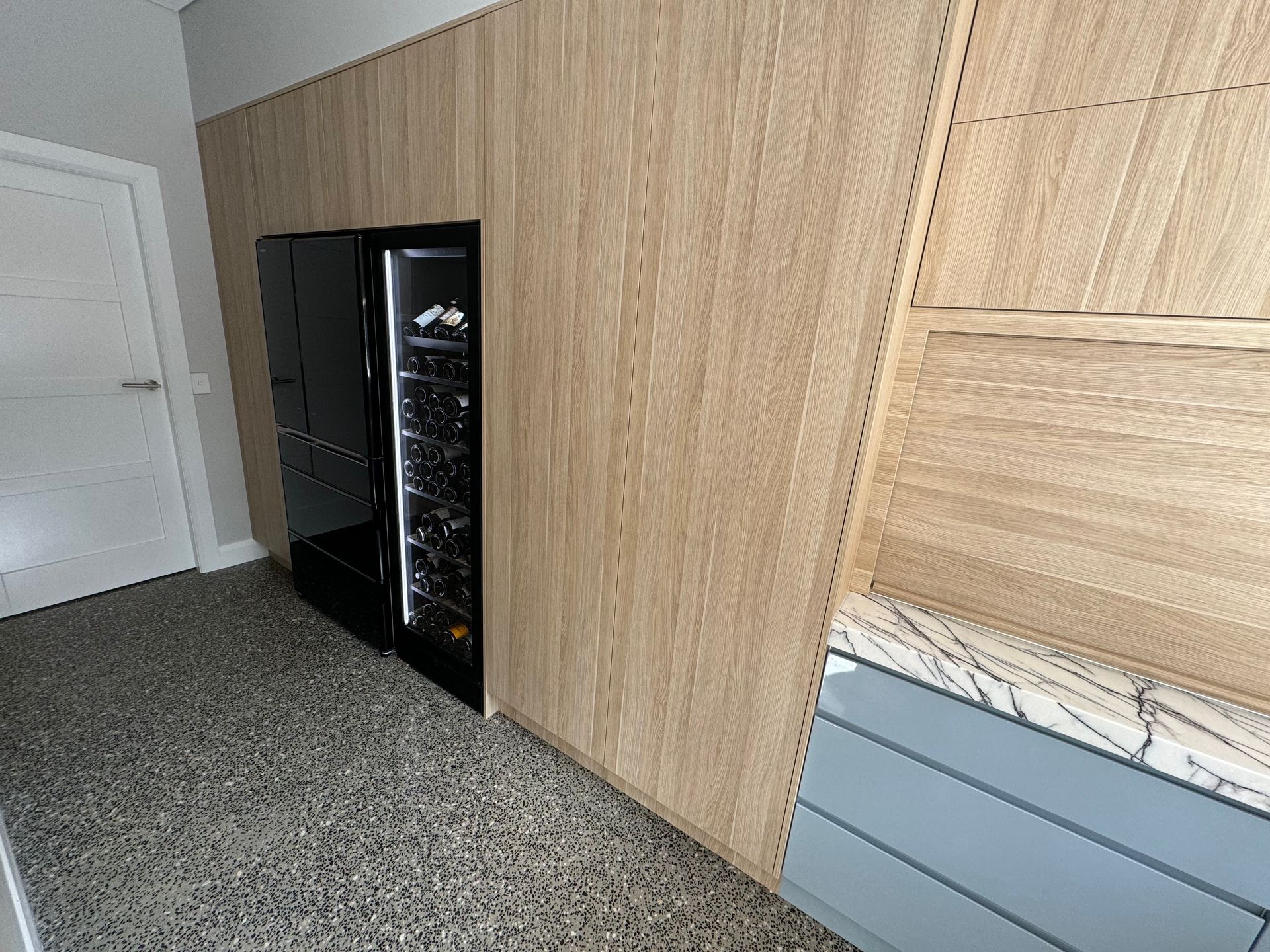 A Kitchen With a Wine Cooler Built Into the Wall — Hey Presto Kitchens & Renovations in Armidale, NSW