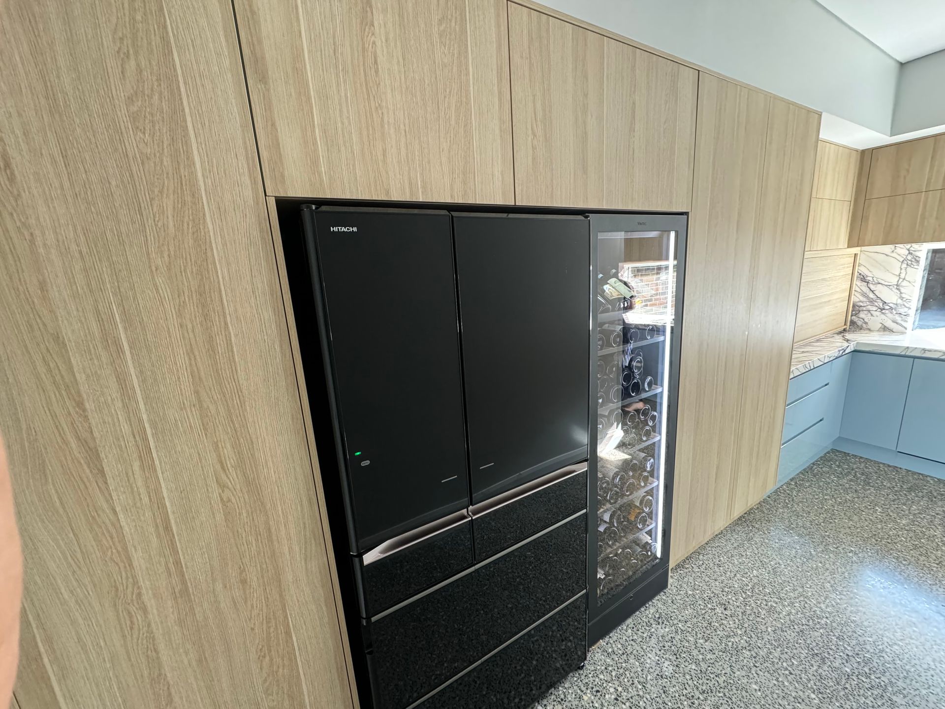 A Kitchen With a Black Refrigerator and a Wine Cooler — Hey Presto Kitchens & Renovations in Armidale, NSW