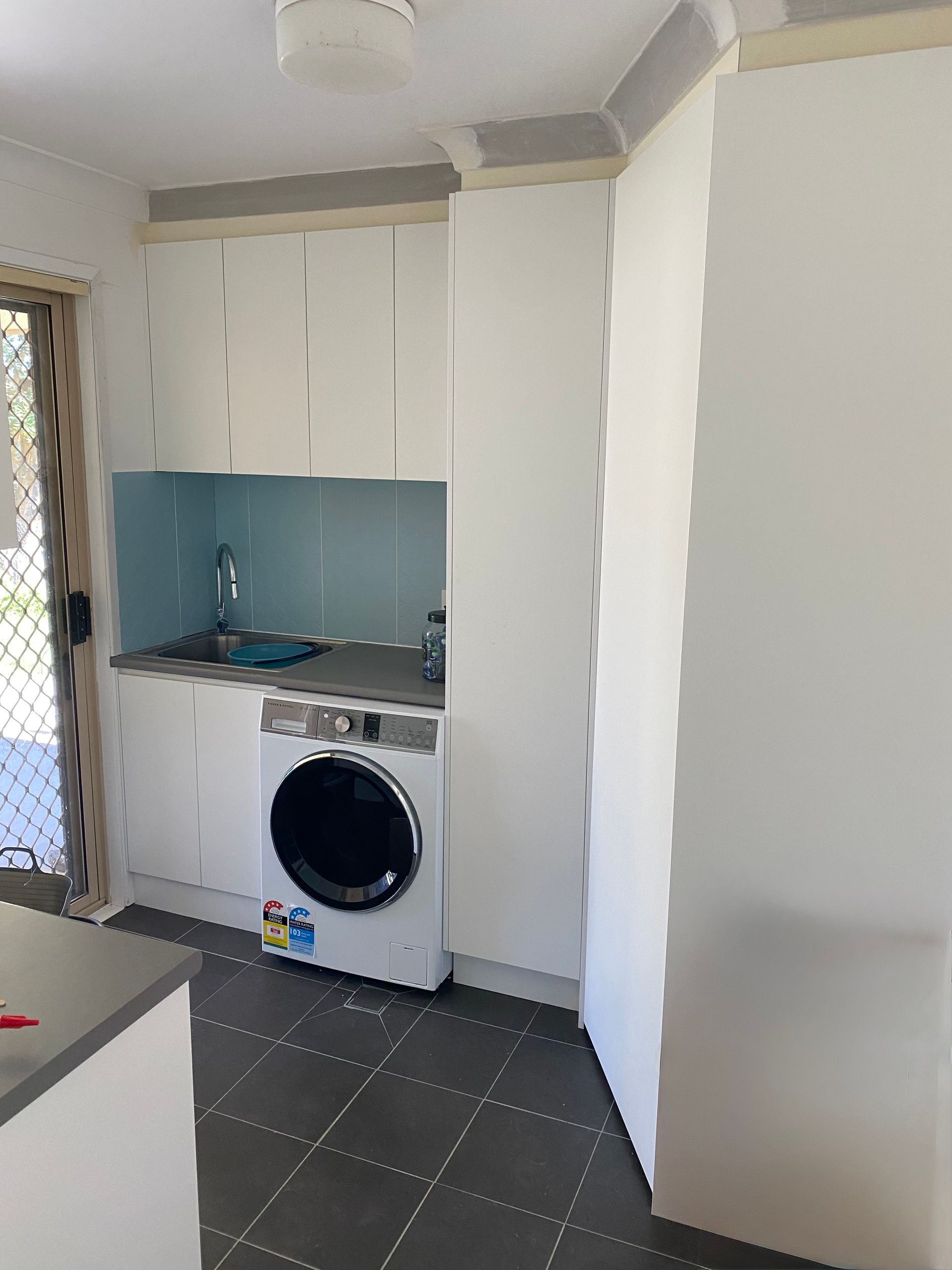 A Kitchen With White Cabinets , Stainless Steel Appliances — Hey Presto Kitchens & Renovations in Armidale, NSW