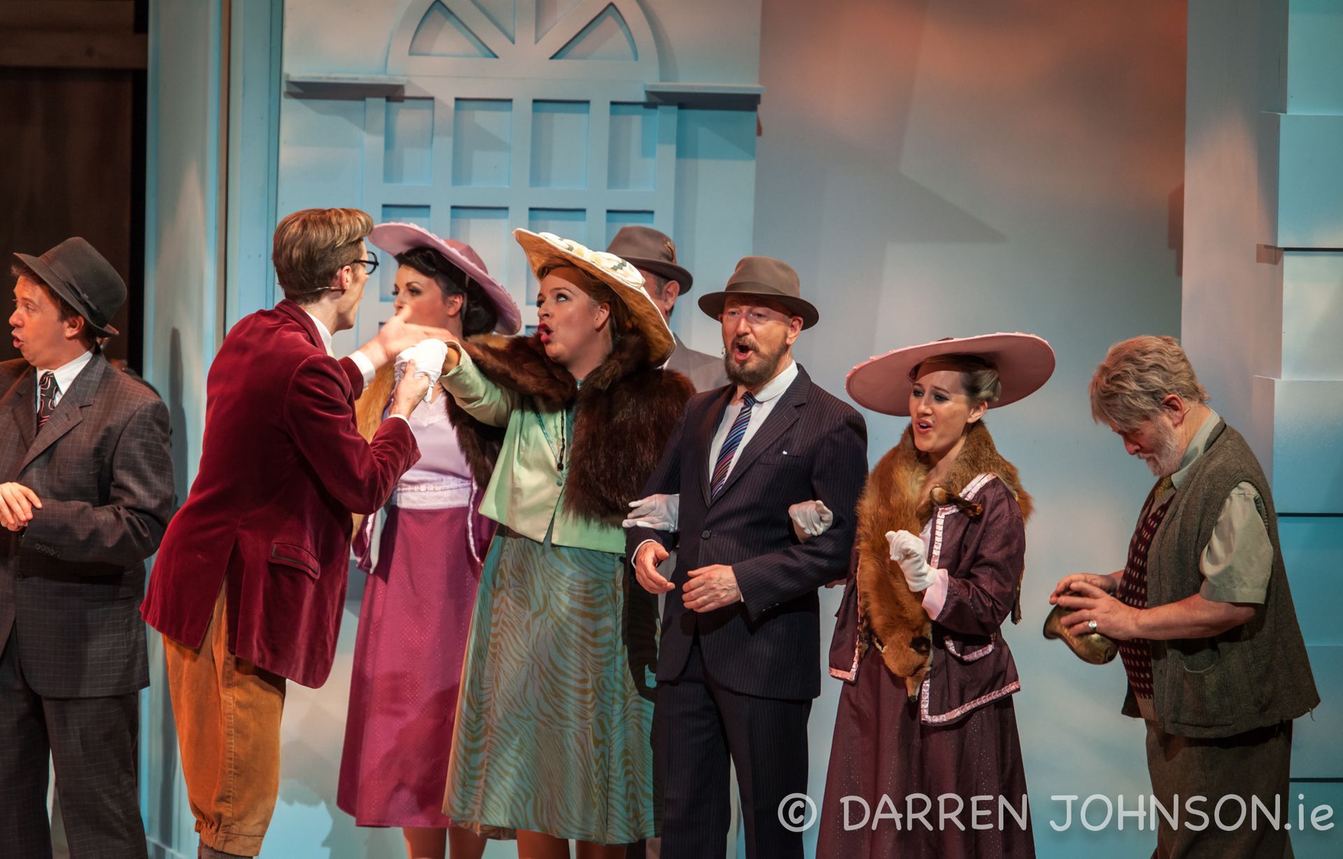 A group of people are standing next to each other on a stage.