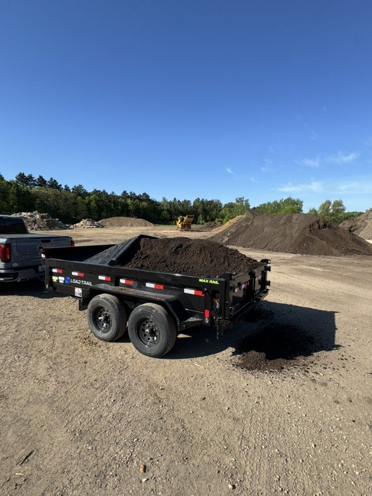 Delivery truck carrying landscaping and construction materials near Sparta, Wisconsin.