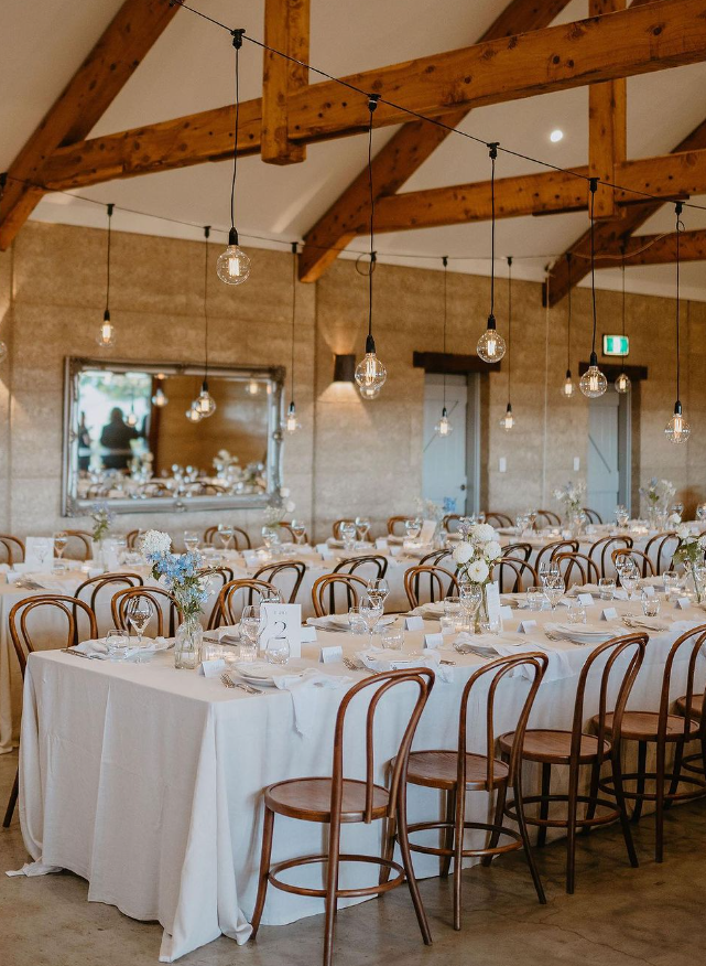 A Large Room With Tables And Chairs Set Up For A Wedding Reception — Wedding & Event Hire In Mullumbimby, NSW