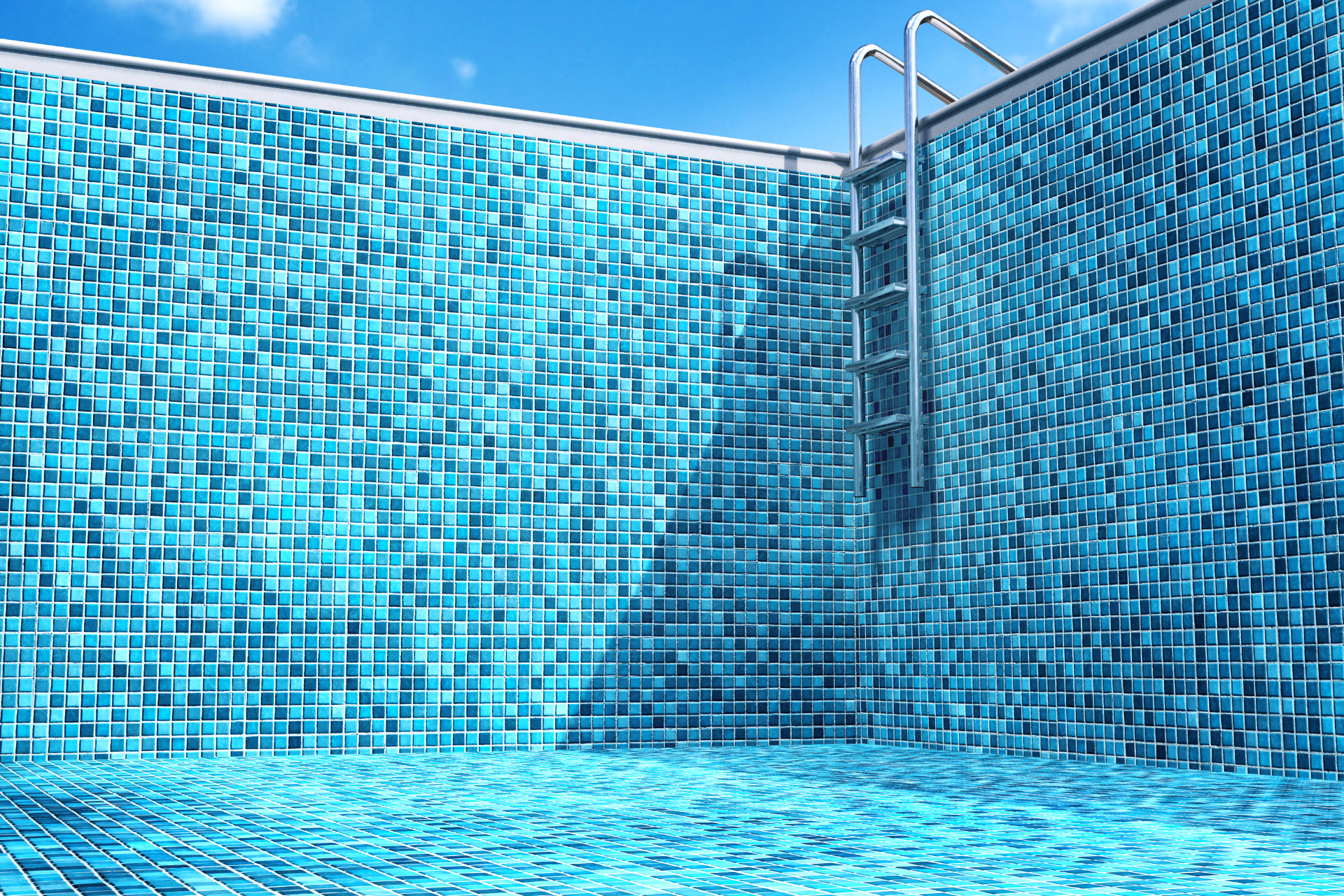 A large swimming pool with stairs leading to it