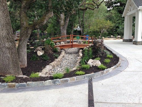Moraga landscaping install with dry river bed